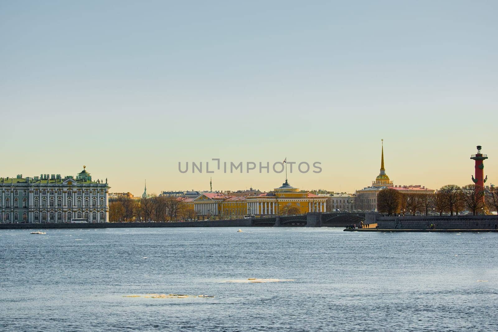 ice drift on the Neva River with a view of the arrow of Vasilyevsky Island with rostral columns, the Winter Palace, St. Isaac's Cathedral, the Savior on Spilled Blood. High quality photo
