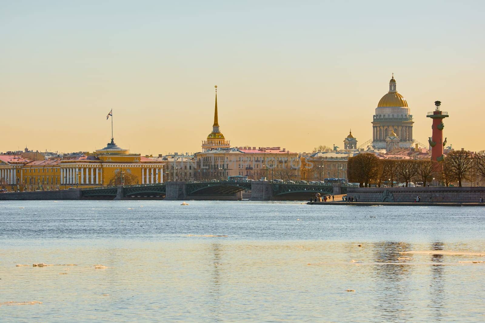 ice drift on the Neva River with a view of the arrow of Vasilyevsky Island with rostral columns, the Winter Palace, St. Isaac's Cathedral, the Savior on Spilled Blood. High quality photo