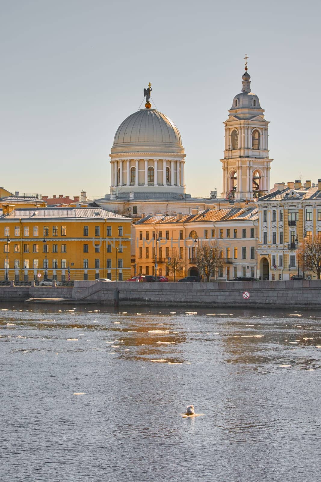 Russia, St.Petersburg, 27 March 2025: Church of St. Catherine the Great Martyr on a sunny spring day, Makarov Embankment, ice drift on the Neva River. High quality photo