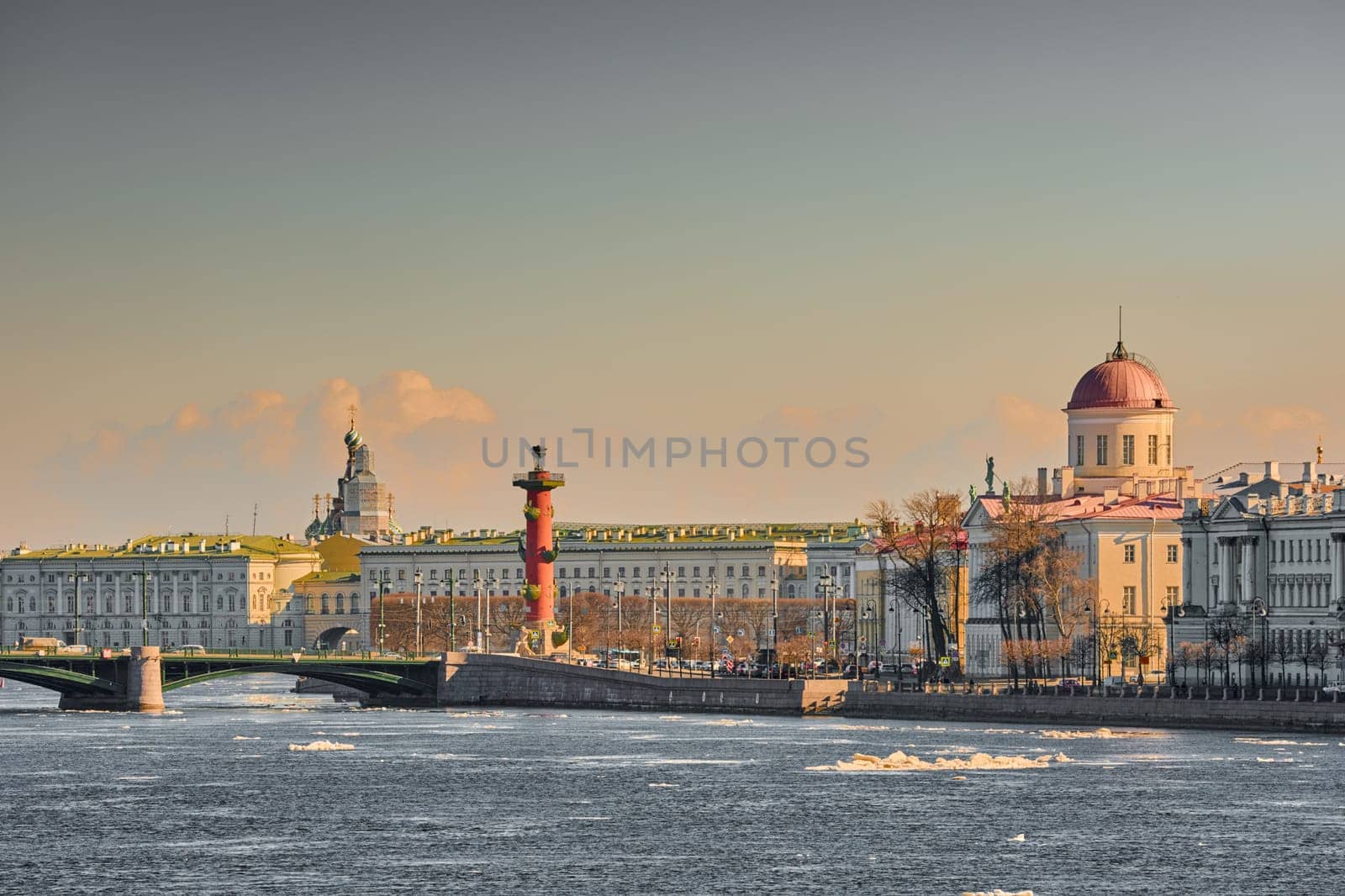 ice drift on the Neva River with a view of the arrow of Vasilyevsky Island with rostral columns, the Winter Palace, St. Isaac's Cathedral, the Savior on Spilled Blood. High quality photo