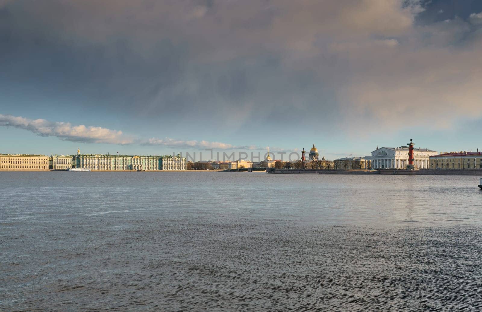 ice drift on the Neva River with a view of the arrow of Vasilyevsky Island with rostral columns, the Winter Palace, St. Isaac's Cathedral, the Savior on Spilled Blood. High quality photo