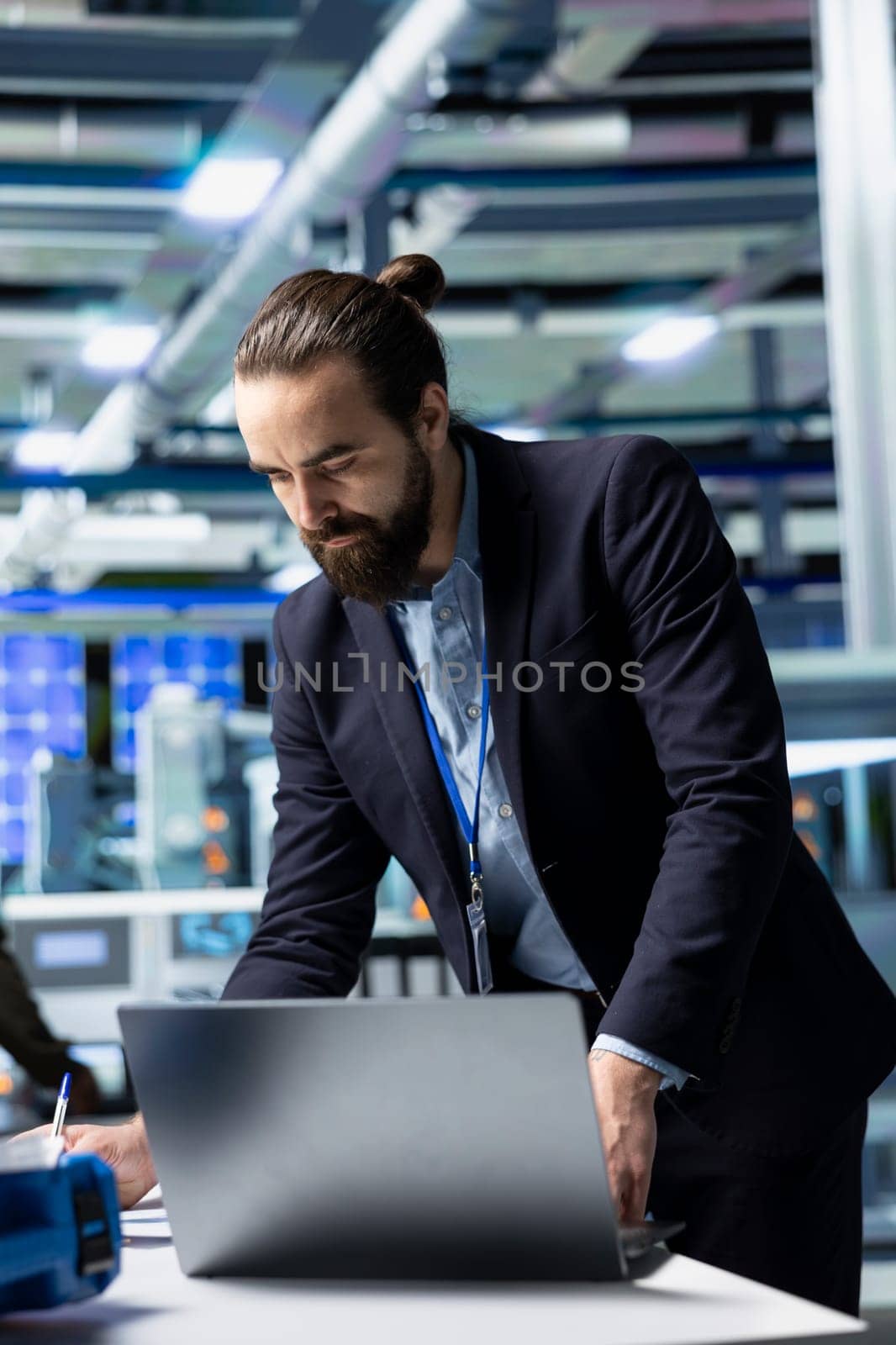 General director in formal suit conducting inspection in a solar panel plant, symbolizing modern infrastructure and leadership in green energy industry. Production planning and technology.