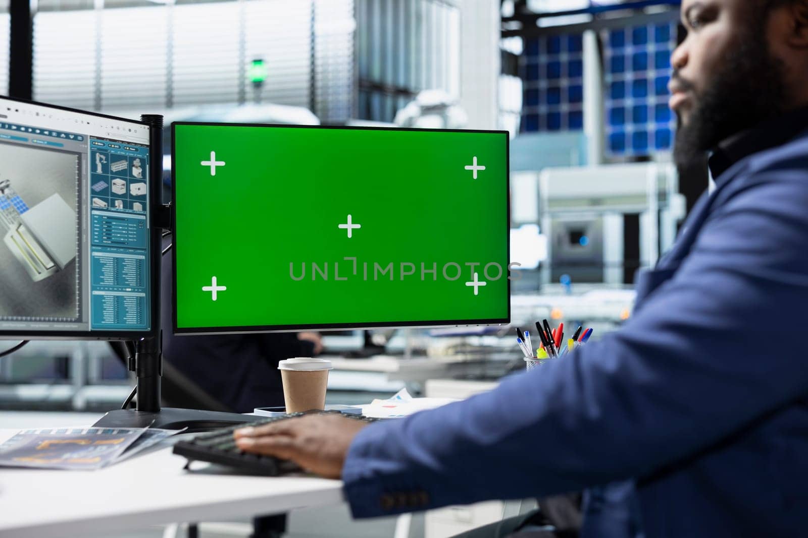 Solar plant employee records inspection notes next to chroma key, actively supporting renewable power goals through precision and workplace accountability. Managing the production.