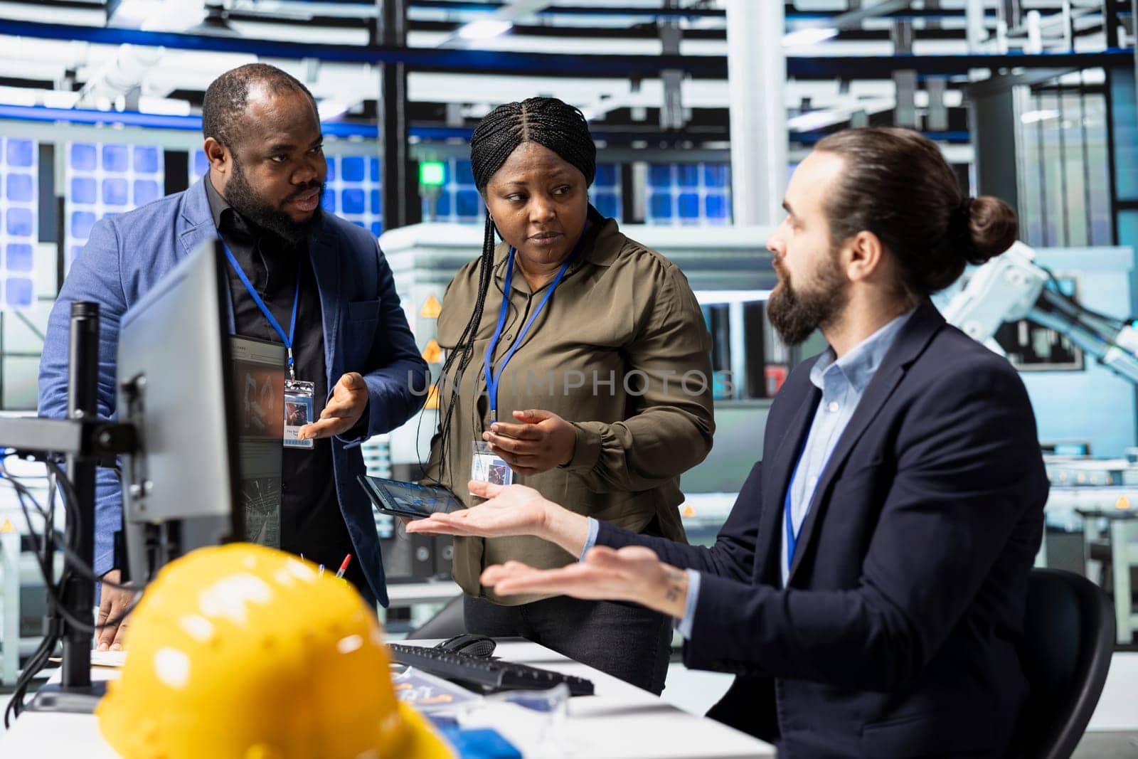 Professional consultants engineers group evaluate production process in solar plant, ensuring every activity supports renewable energy goals and efficient industrial operations.