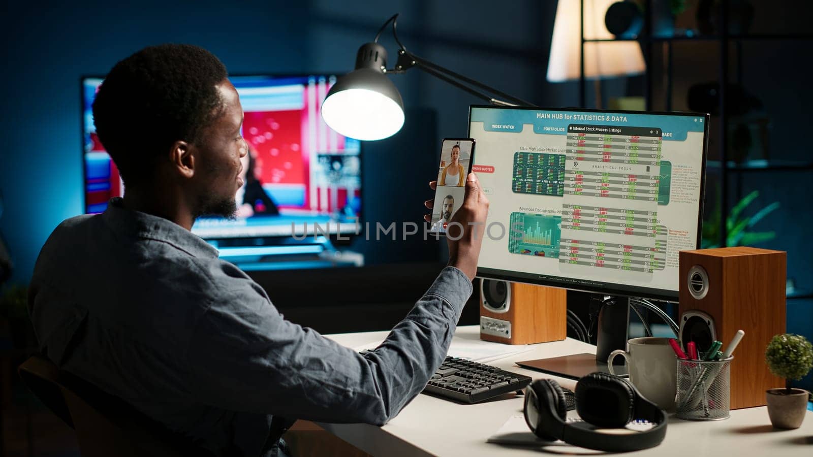 Black economist on video conference chat with consultants analyze earnings balance and tracking financial fluctuation for a potential growth. Specialist debating with his associates. Camera B.