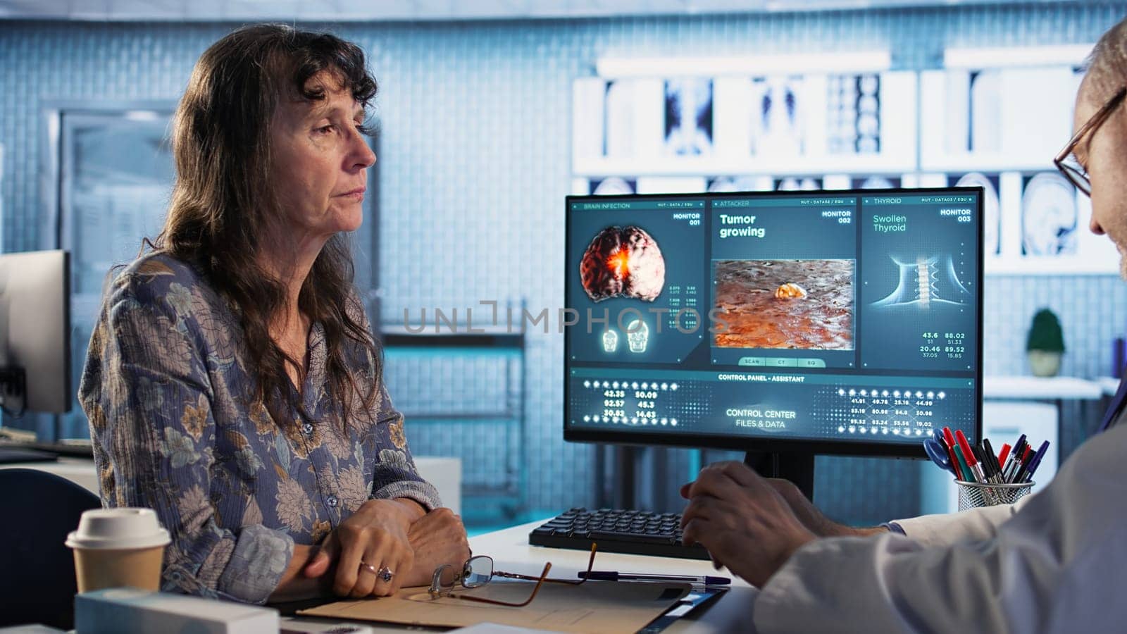 Doctor provides cancer screening guidance to a patient in office, discussing MRI scans and tumor growth. Early detection and preventative medicine are emphasized for better health outcomes. Camera A.