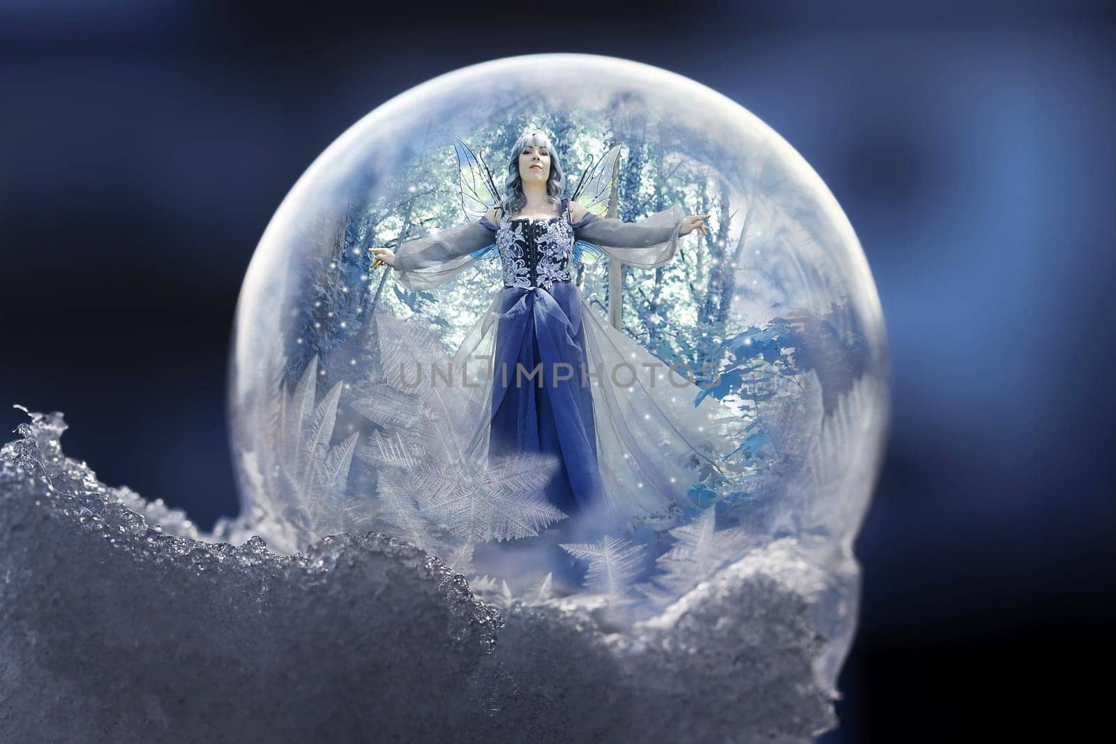 A fairy in a ball of ice makes it snow and freeze