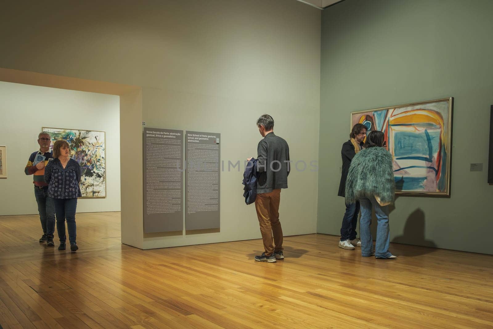 Jan 13, 2024 - Lisbon, Portugal: Visitors engage with diverse paintings in exhibitions at Berardo Collection Museum, navigating halls, reading information panels and observing artwork of Portuguese and international art from 20th and 21st centuries