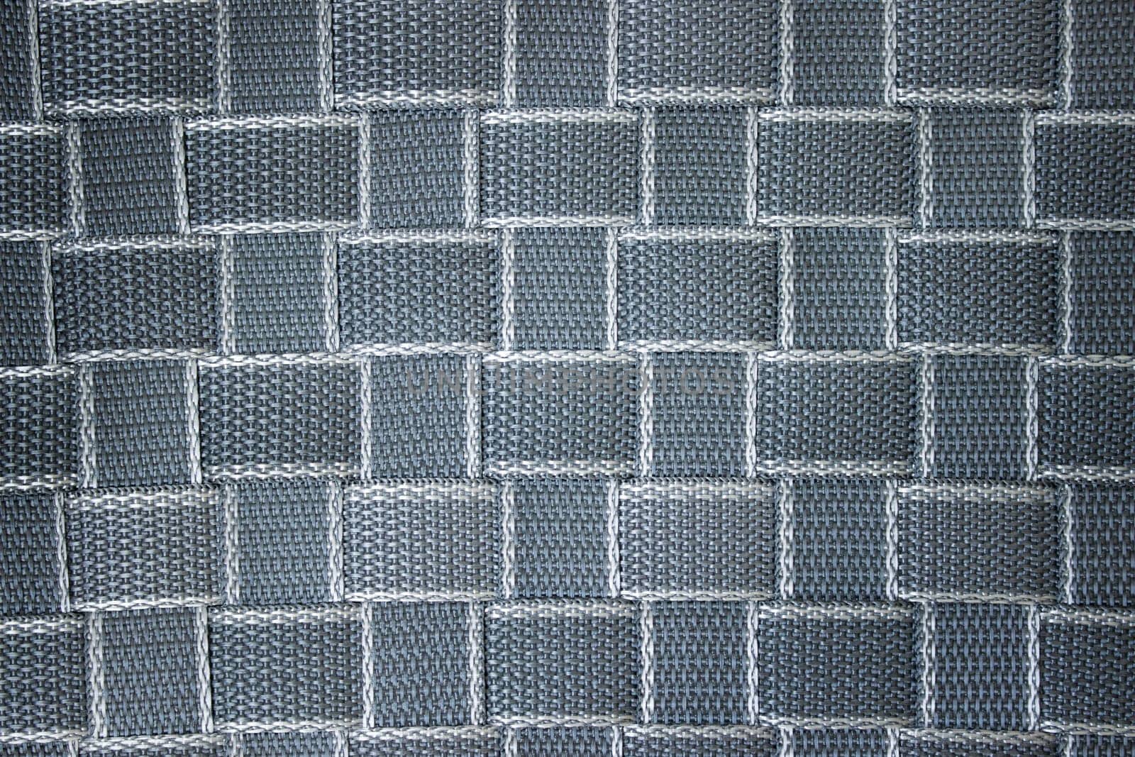 Woven surface of propylene tape, textured gray-blue background. High quality photo