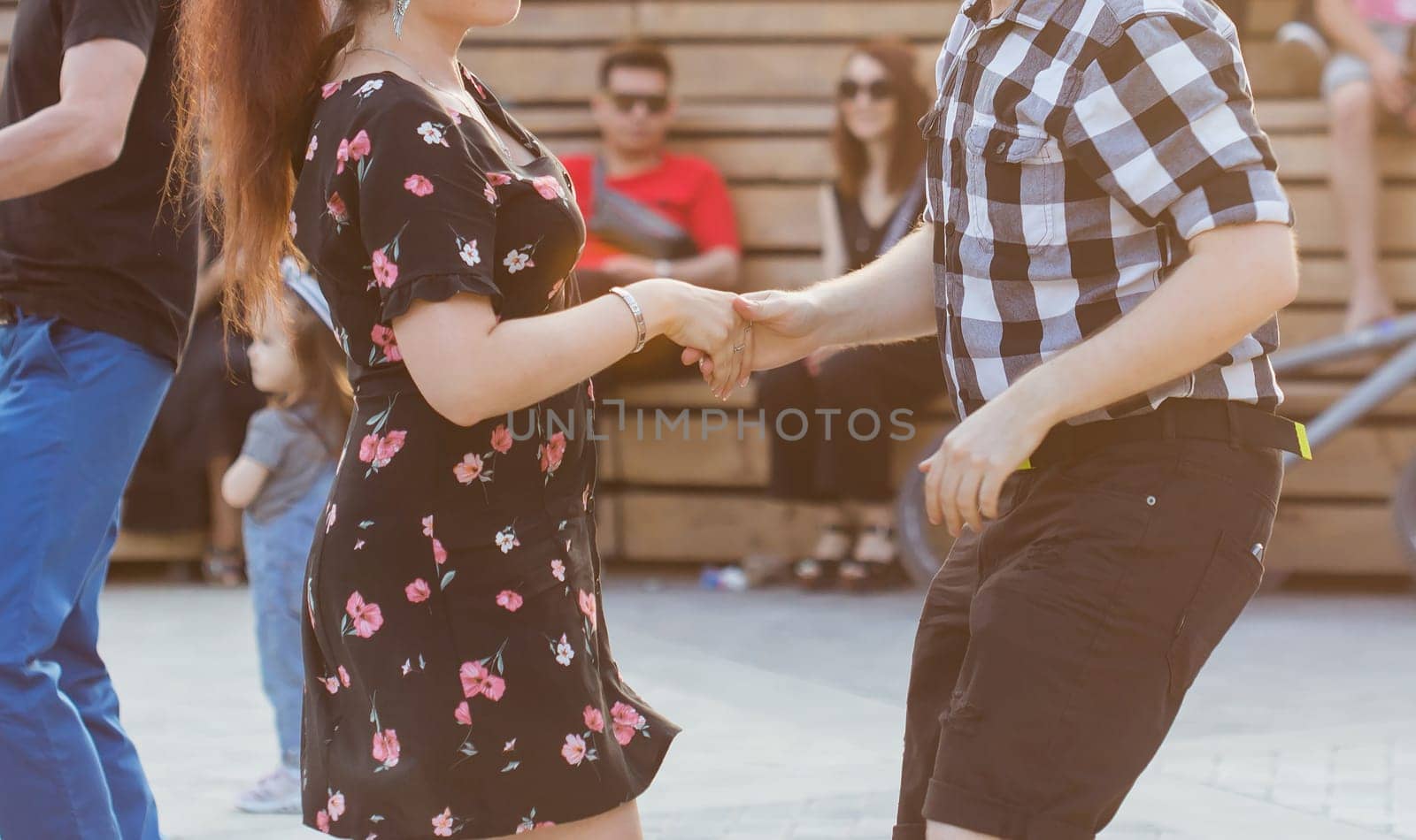 Kizomba, bachata or salsa concept - beauty couple dancing social dance on open air party