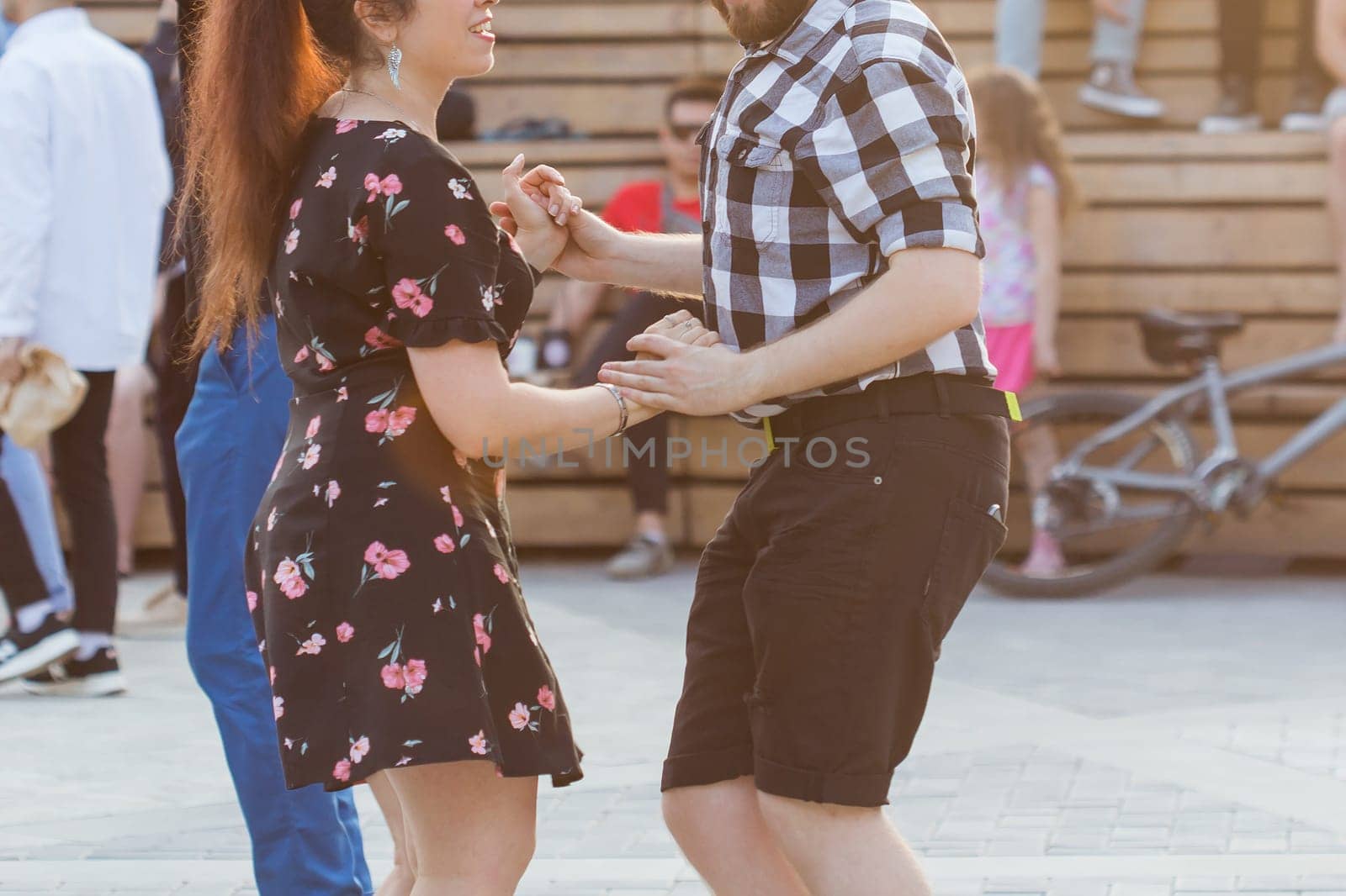 Kizomba, bachata or salsa concept - beauty couple dancing social dance on open air party