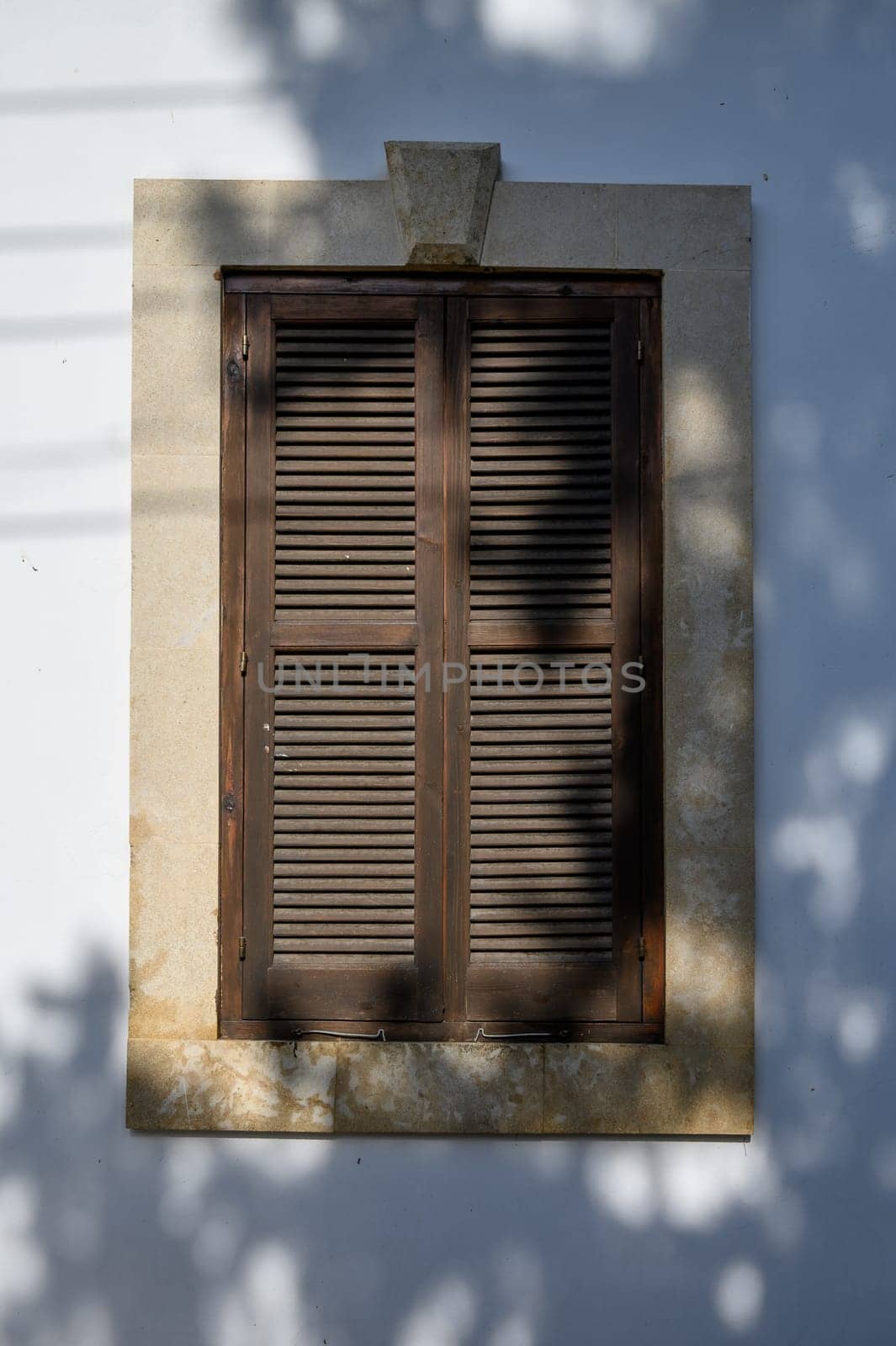 Traditional Window with Wooden Shutters in Cyprus