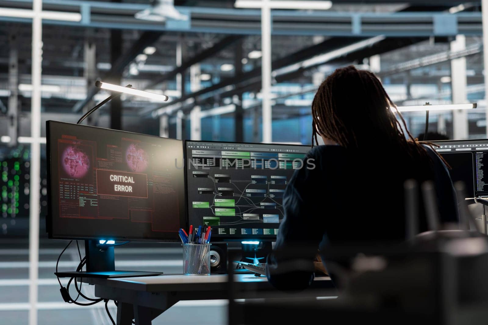 Data center engineer finding critical error in equipment used for machine learning training. Server farm IT expert fixing bugs in computer code affecting artificial intelligence systems performance