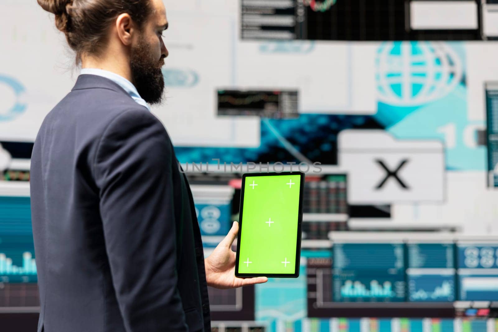 Male administrator using chroma key display for a digital analysis, ensures financial planning and business success with digital growth driven tools and monthly reports. Insightfulness.