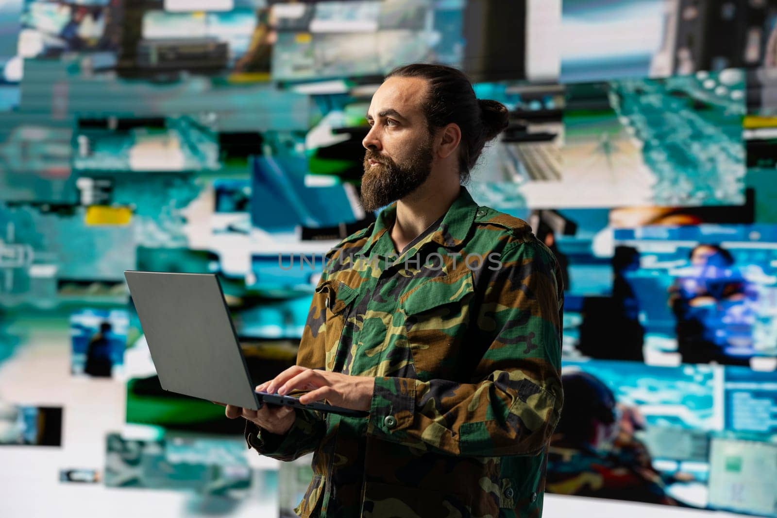 Male soldier operates in a virtual war zone using digital technology and threat detection tools, showcasing modern military strategy. Ensuring secure communications in active operations.