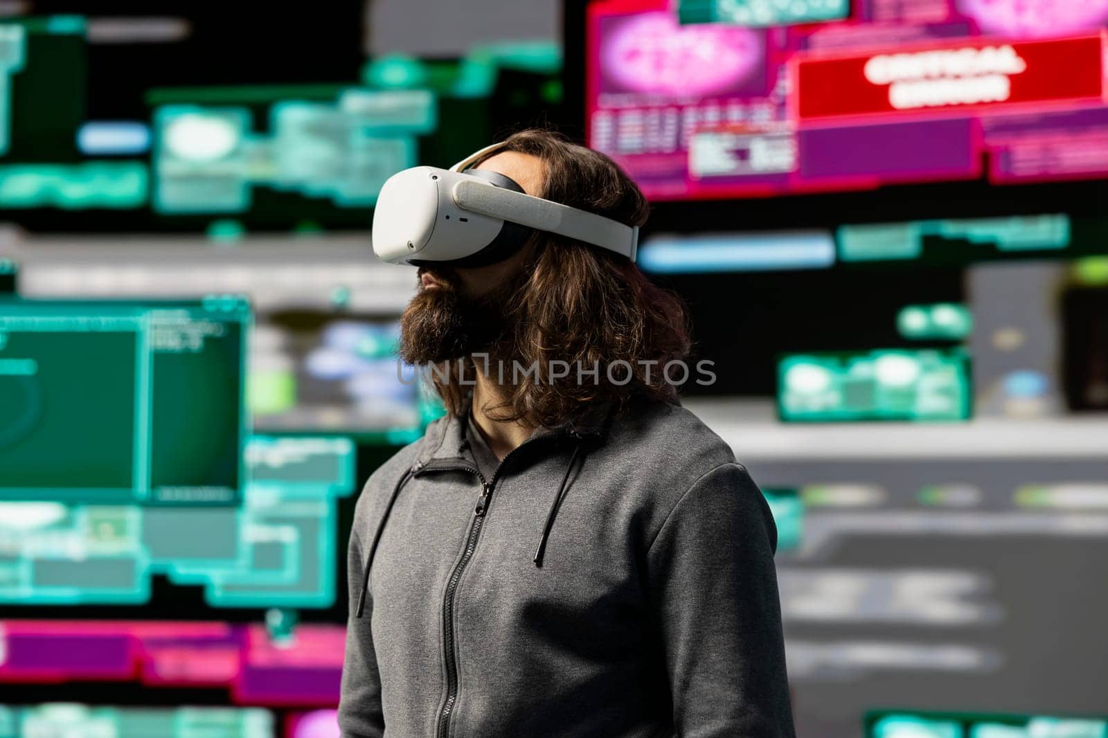 Hacker uses virtual reality glasses for system infiltration and penetration, cyber intelligence define this tech driven information theft. Intrusion and threat alerts reveal dangerous hacking.