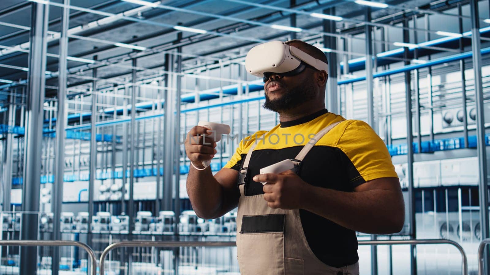 Smart factory engineer using VR headset to oversee operation of robotic arms and conveyor belts. Industry 4.0 plant technician monitors system performance using virtual reality, camera A