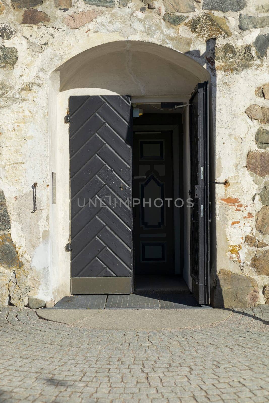 A peaceful Lutheric cemetery in Finland, door to the medieval stone church.