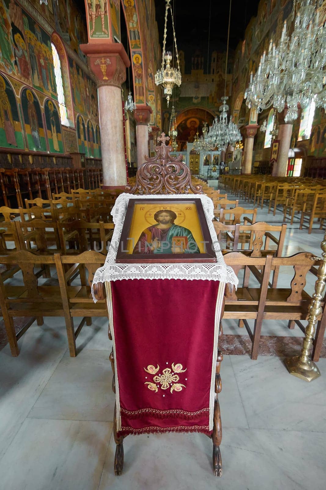 Detail of a venerable icon of Jesus Christ on an ornate lectern, located in the central nave of the Church of Annunciation. A symbol of faith.
