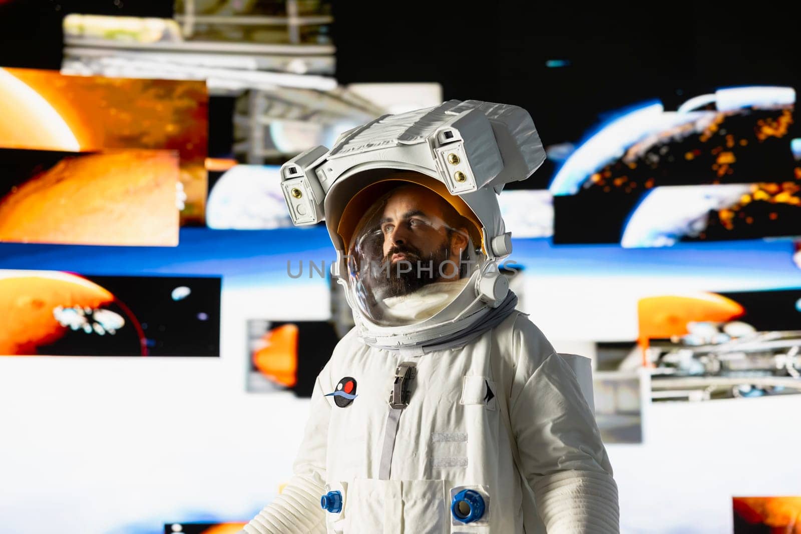 Male astronaut in a space suit floats in orbit above Earth, symbolizing the journey of humanity into cosmos. Endless pursuit of discovery, technology and exploring the unknown universe.