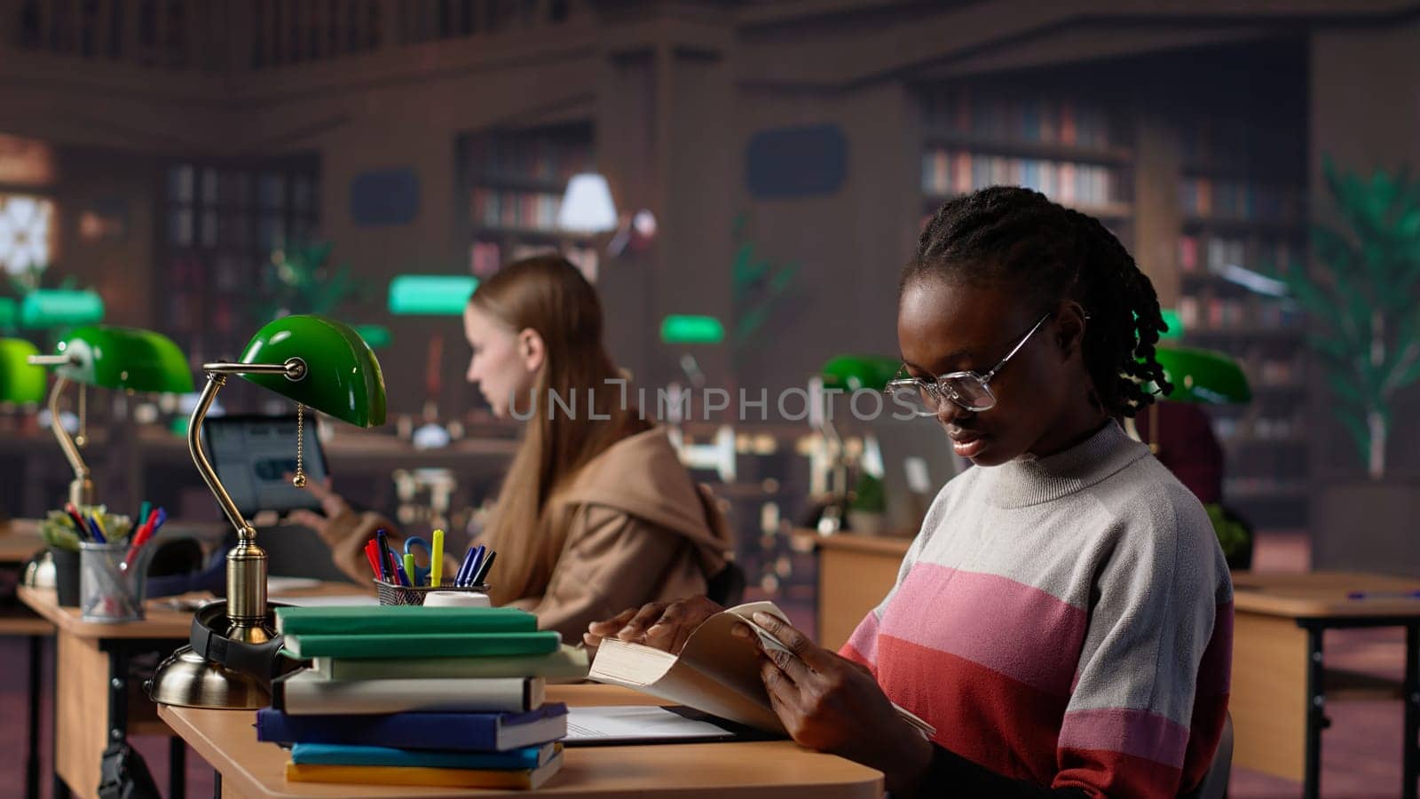 Black girl reading books and handwritten class notes right before the exam, making preparations all night to get a high grade for scholarship. Young adult shows dedication and ambition. Camera A.