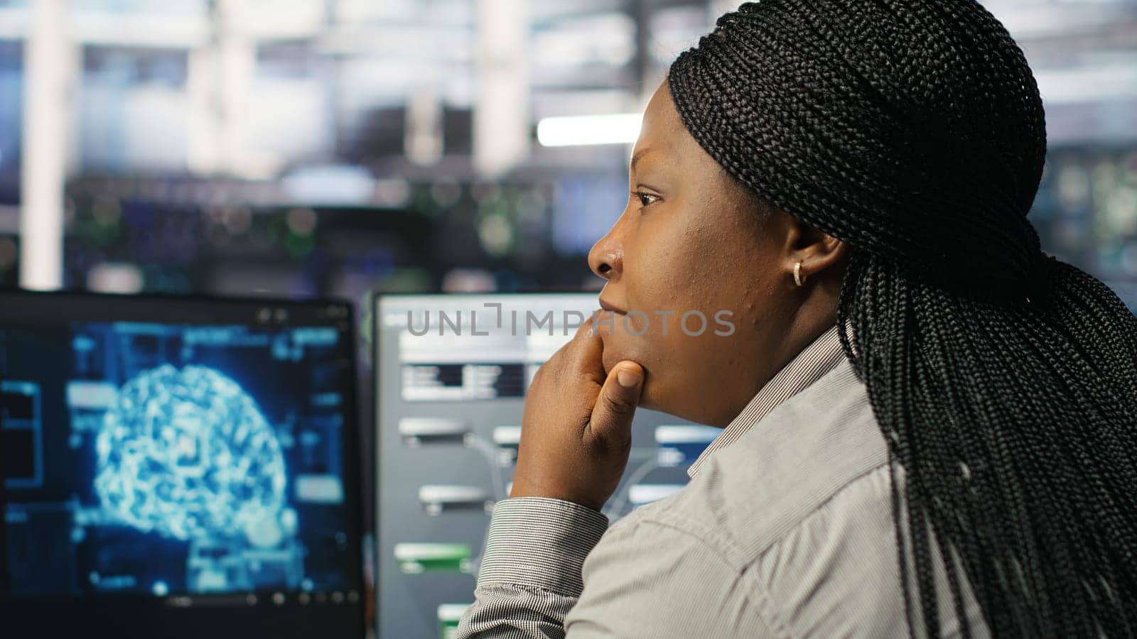 Data center computer scientist using artificial intelligence deep learning models to configure hardware. IT specialist using AI programming languages on PC in server farm, optimizing system, camera B
