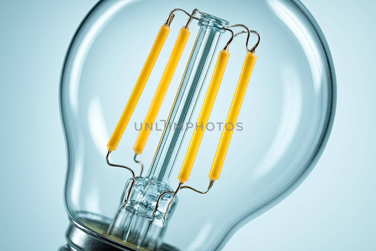High-Key Macro of LED Filament Bulb Interior in Pastel Light