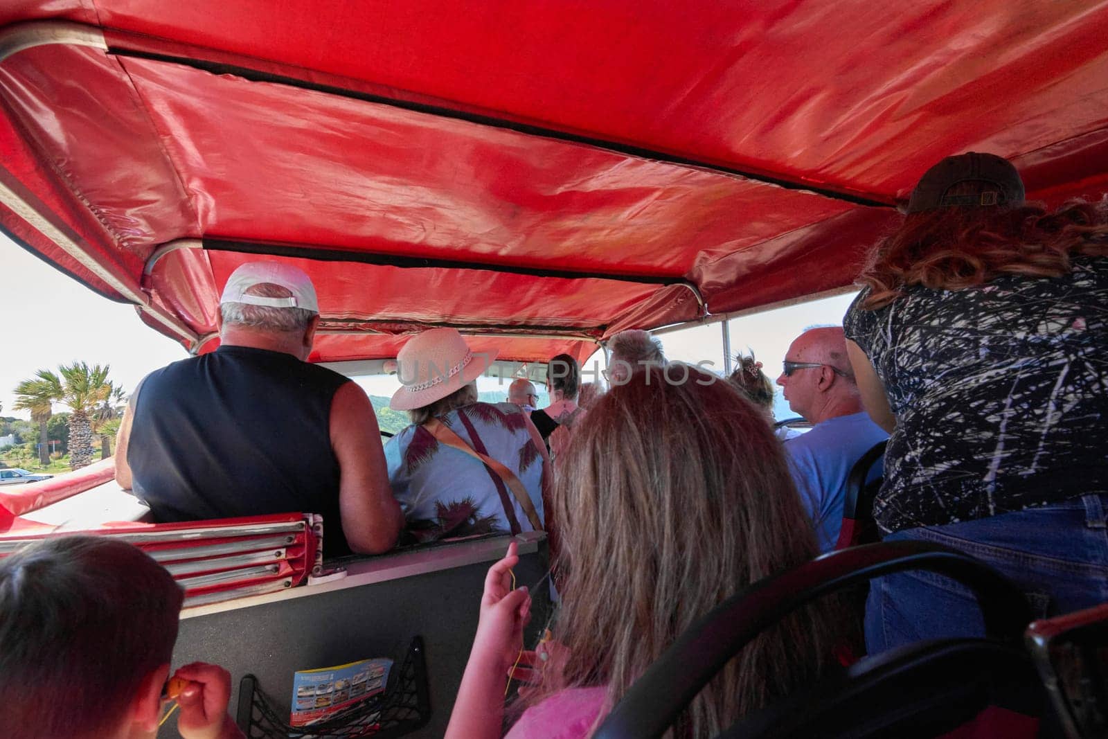 Rodas.Greece - june 06, 2025: Tourists aboard a sightseeing bus in Rhodes. Travel experience in a tourist vehicle.