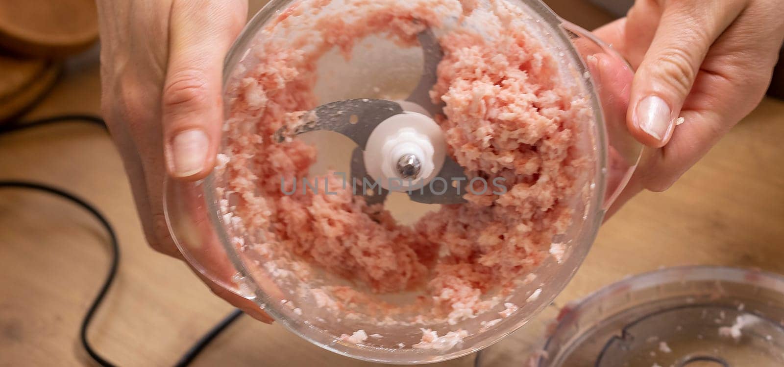 Just ground meat mince in the glass bawl of the electrical chopper on the kitchen counter top