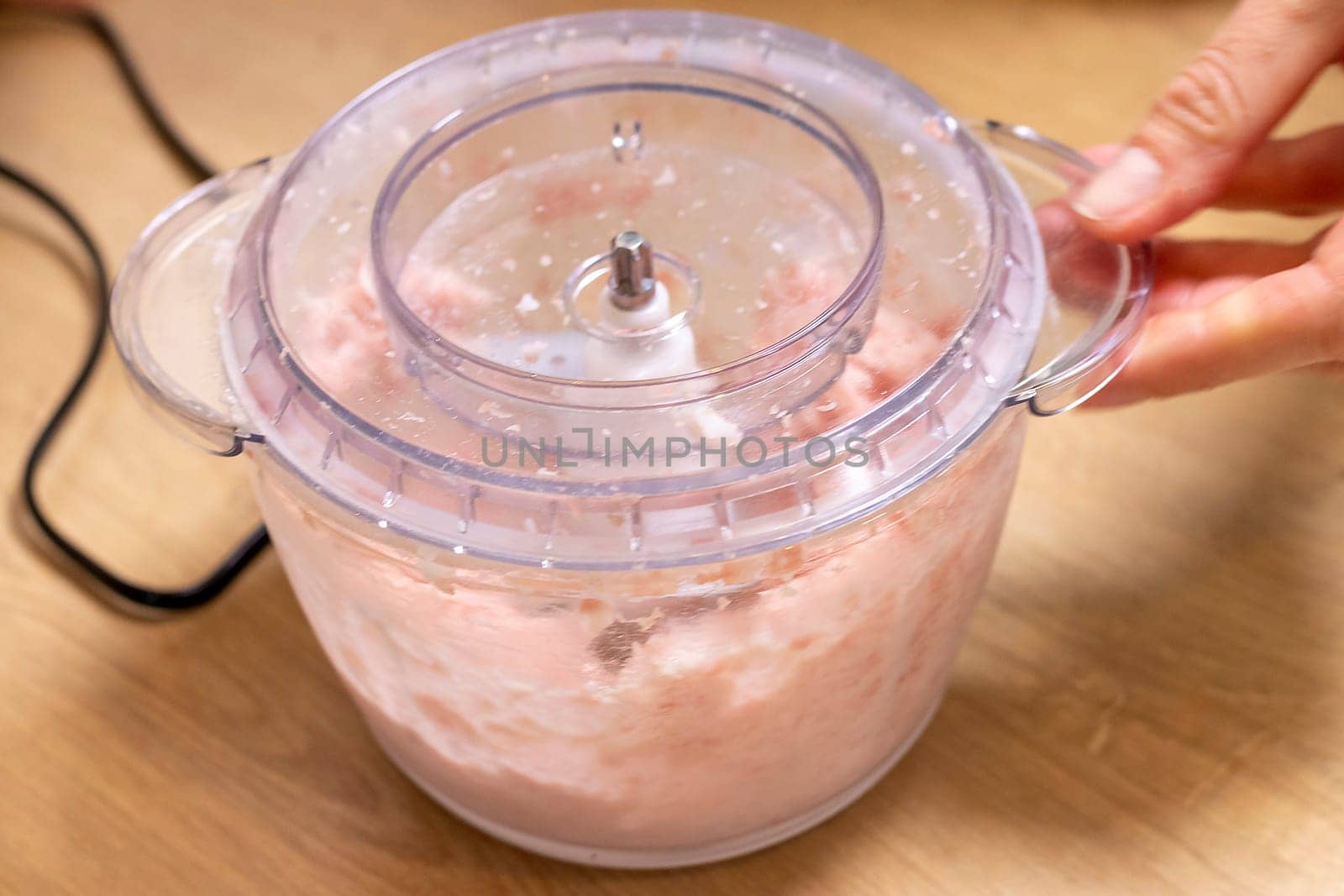 Just ground meat mince in the glass bawl of the electrical chopper on the kitchen counter top