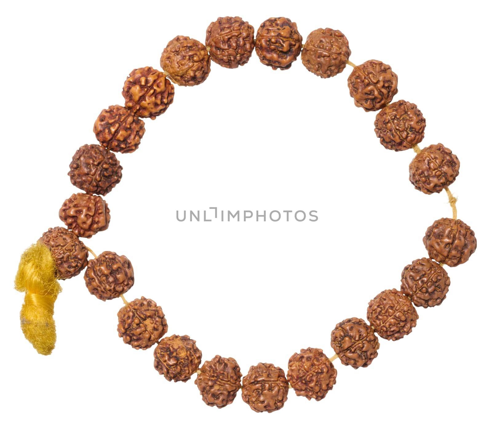 A Rudraksha bracelet made of brown beads with a yellow tassel, forming an open circle, isolated background