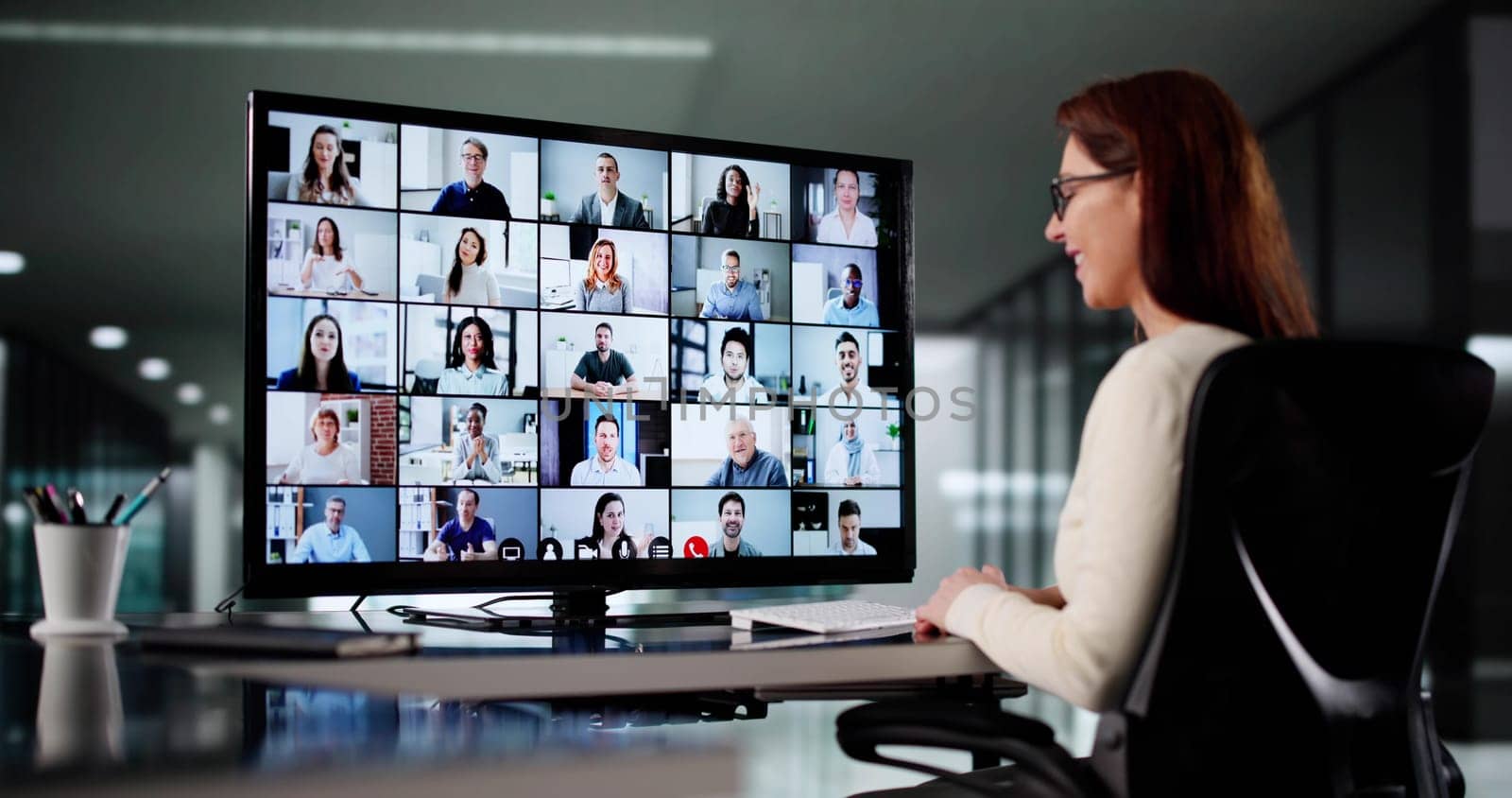 Young Female Executive Uses Video Conferencing For Online Business Meeting.