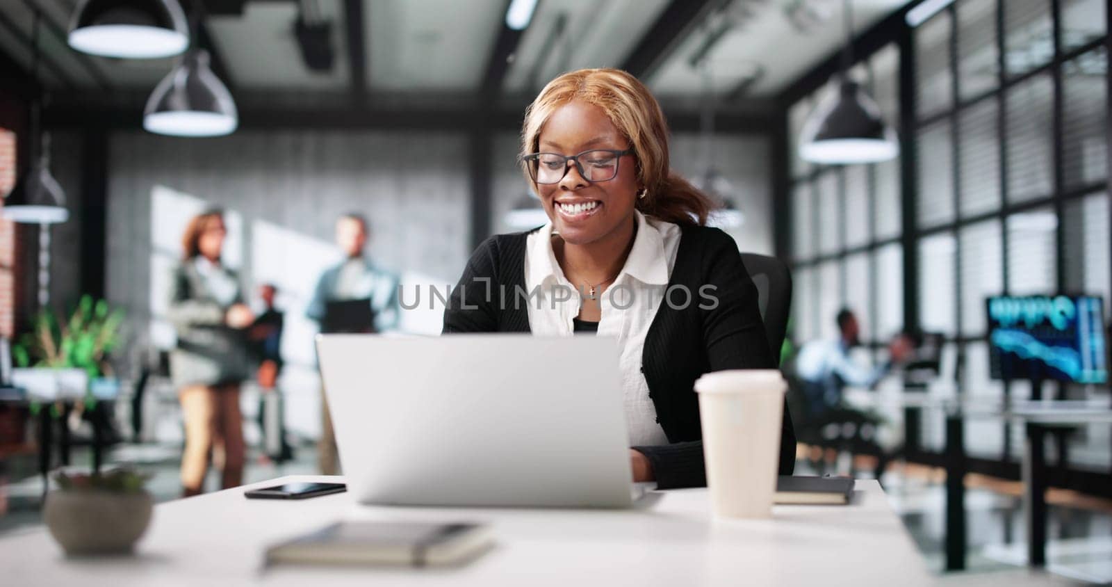 Successful Businesswoman Engaging In Video Conference From Her Office.