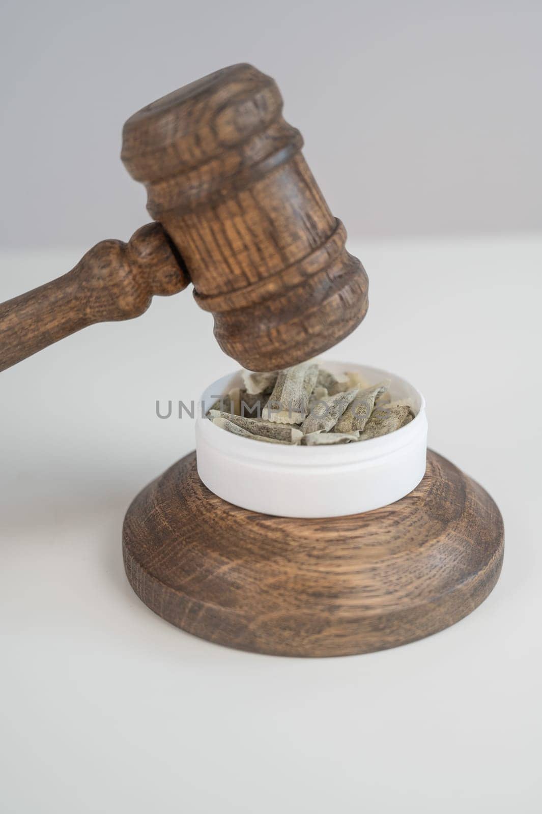 Judge Bangs Gavel. Chewing Tobacco Ban