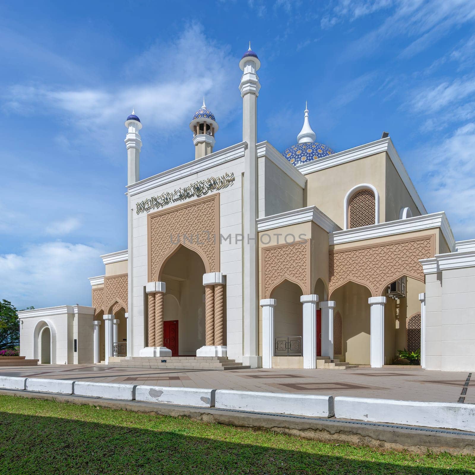 Brunei International Airport Mosque, in Bandar Seri Begawan, invites travelers and worshippers to experience its divine ambiance with its intricate design and expansive entrance under azure sky