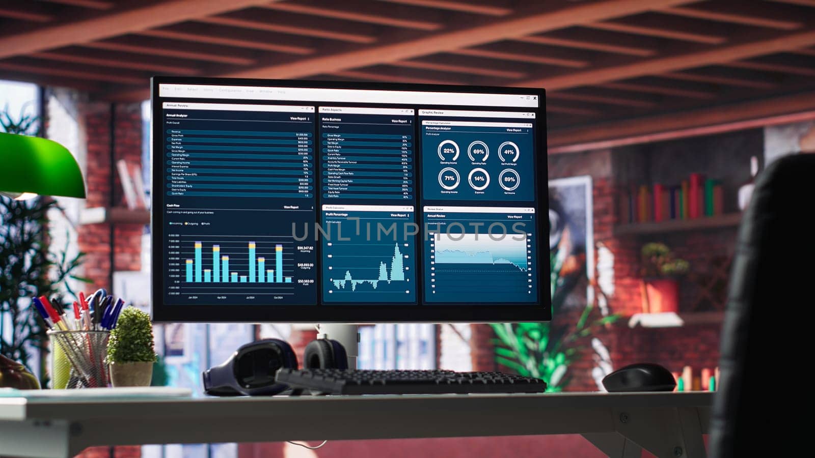 Desktop PC on the wooden desk showcases infographics and client reach data for professional use, analytics on display. Stylish, organized workspace in a bright luxurious loft home.