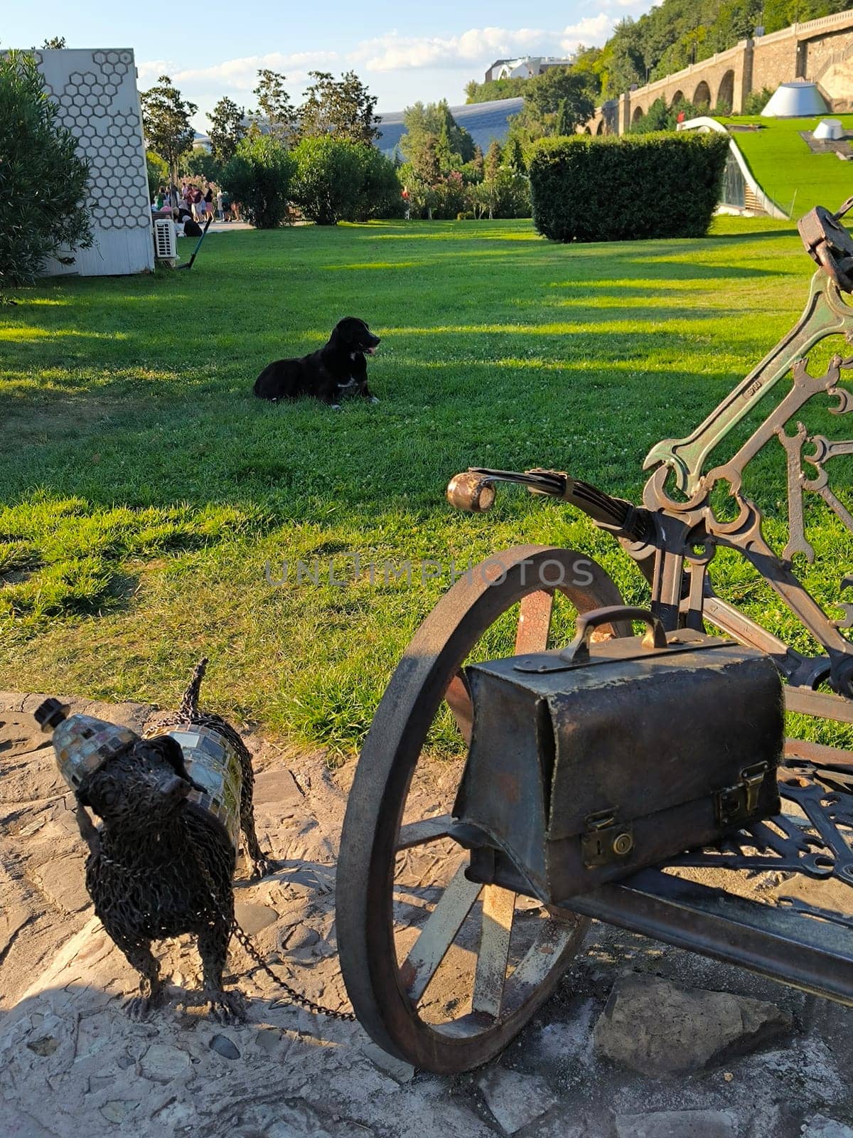 17 August 2024 Tbilisi Georgia Dog sculpture garden green nature summer autumn background landscape street art architecture grass grassy ground park outdoor travel trees shotlisttravel . High quality photo