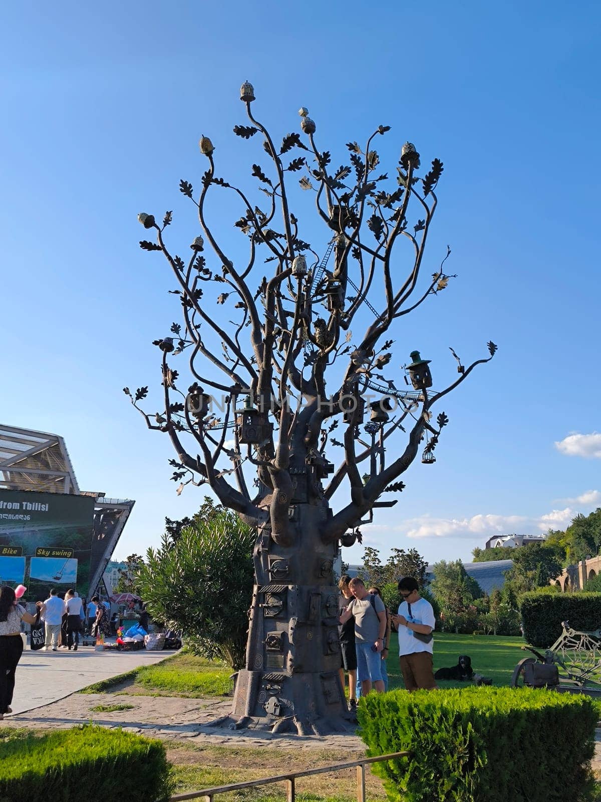 17 August 2024 Tbilisi Georgia Metallic artistic tree trees green nature summer autumn background landscape travel tourism shotlisttravel nature people park . High quality photo blue sky landscape