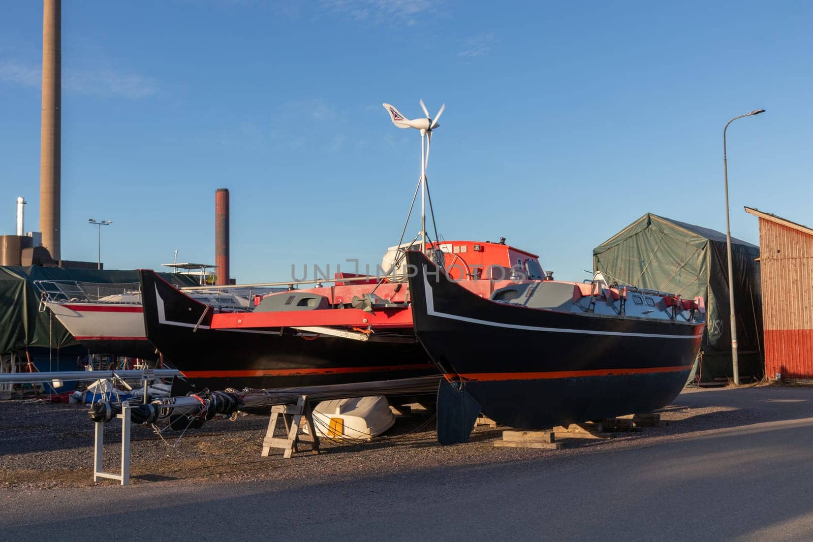 Sailboats stored out of the water for the winter, winter storage for the sailboat in Finland, Suomenoja, winterizing , short season in Northern country, cold conditions