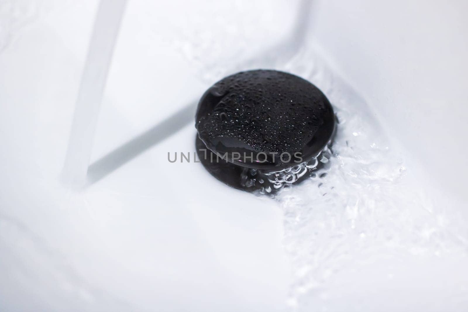 Imagine a black hole located in a sink where water is continuously running out of it, creating an intriguing optical illusion of plumbing malfunction