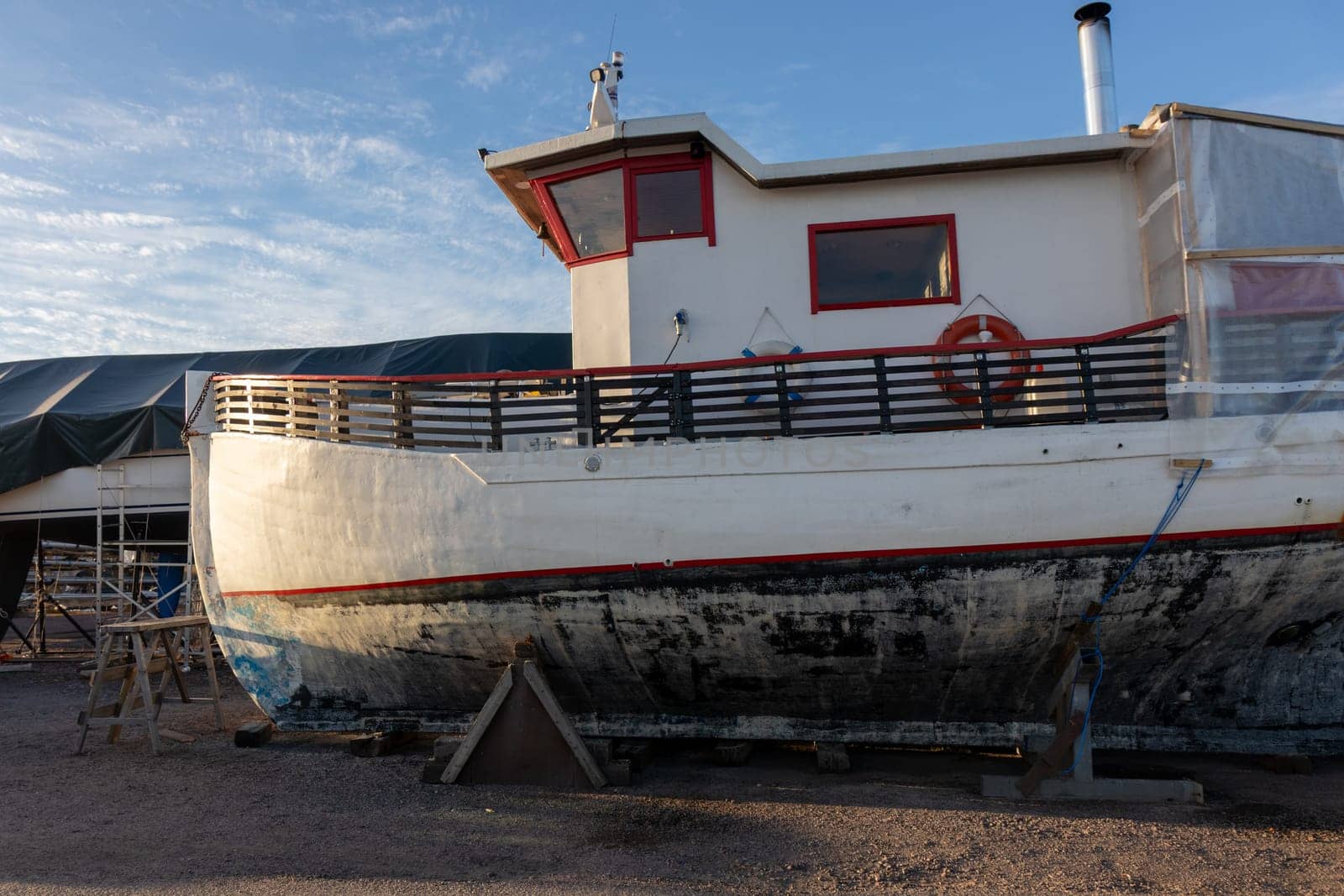 Boat stored out of the water for the winter, winter storage for the boat in Finland, Suomenoja, winterizing , short season in Northern country, cold conditions