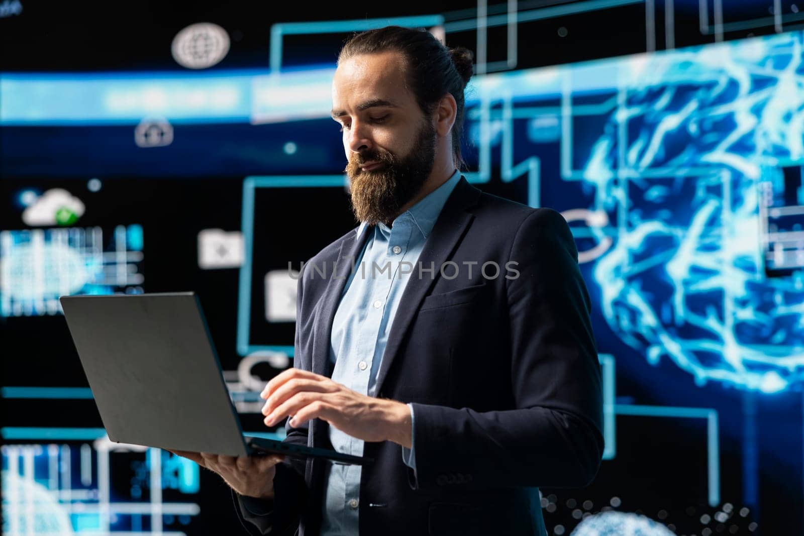 Entrepreneur uses laptop to review artificial intelligence brain system on dashboards, using high tech data visualization for coding, analytics and machine learning. Strategic development.