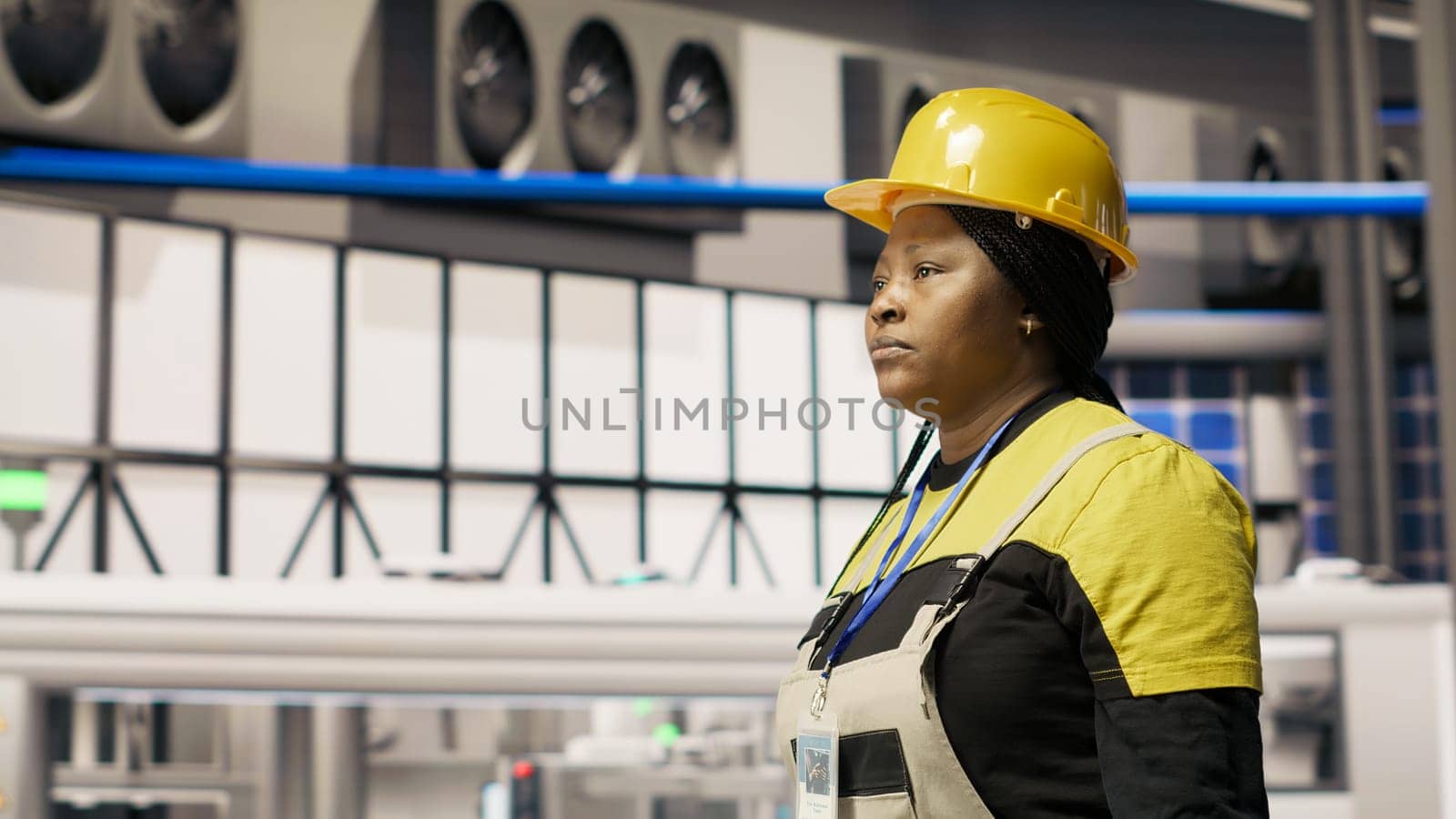 Mechanic holding toolbox walking in smart factory, preparing to do maintenance. Repairman inspecting industry 4.0 plant facility, looking for equipment damages to fix, doing upkeeping, camera B