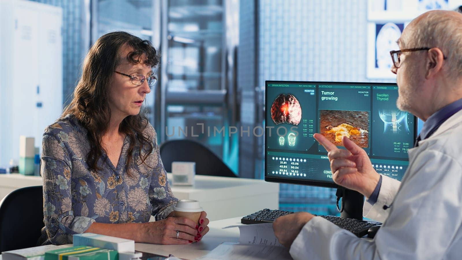 Physician and patient discuss an x ray and MRI scan focusing on preventive medicine and cancer awareness strategies. Educating a woman on chemotherapy options and preventative care. Camera B.