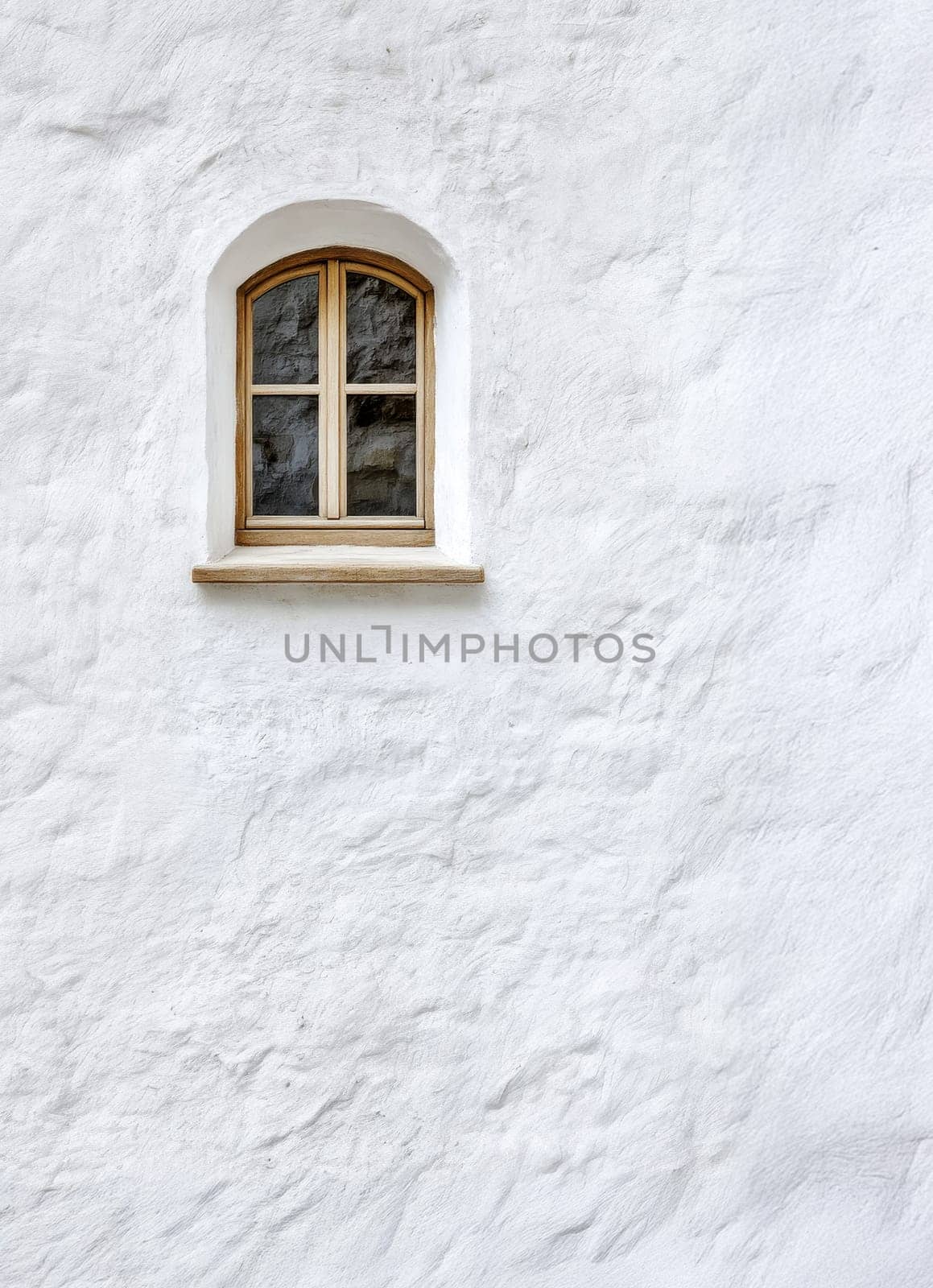 Small Arch Window in White Textured Wall..