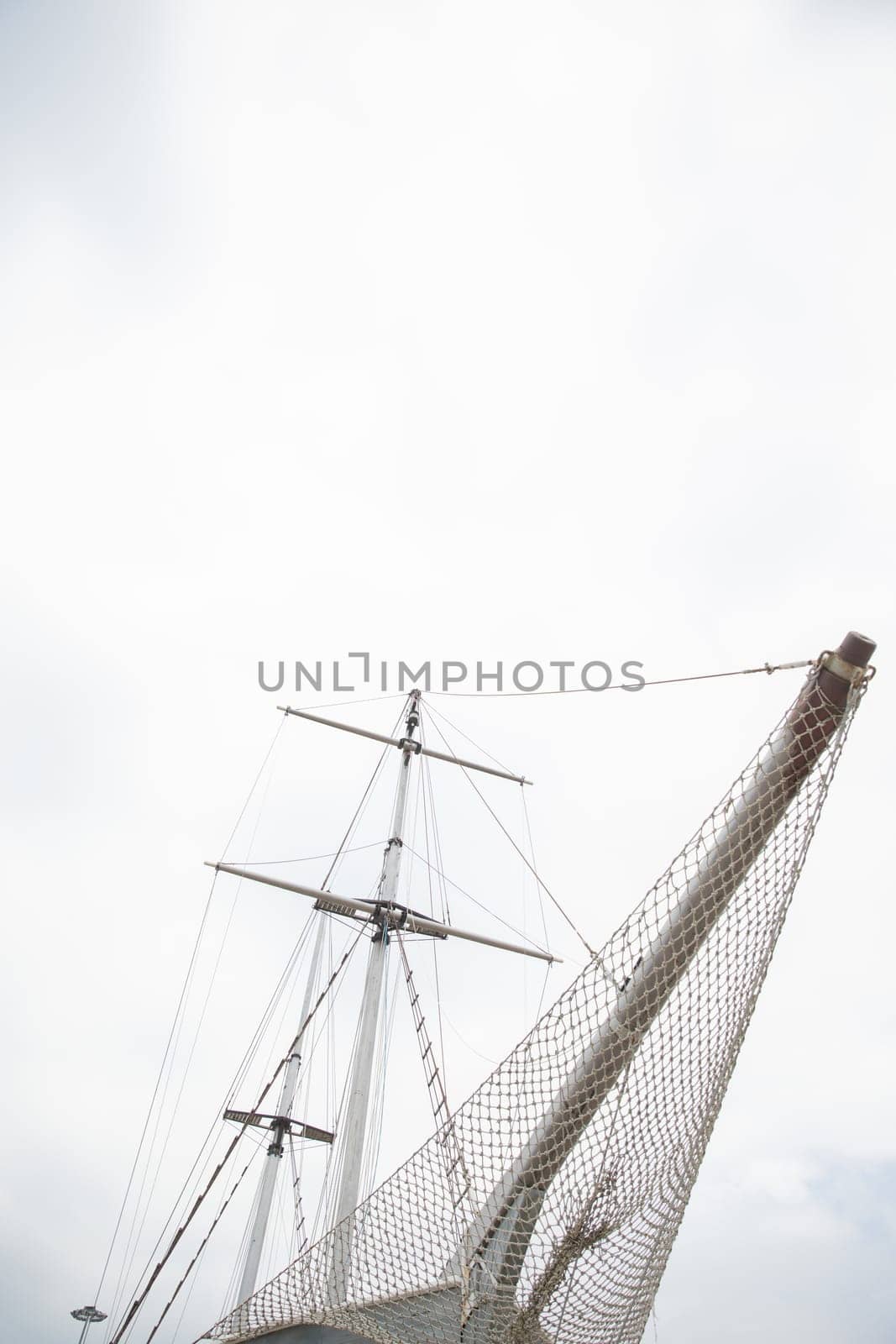 masts of a wooden ship in the roadstead