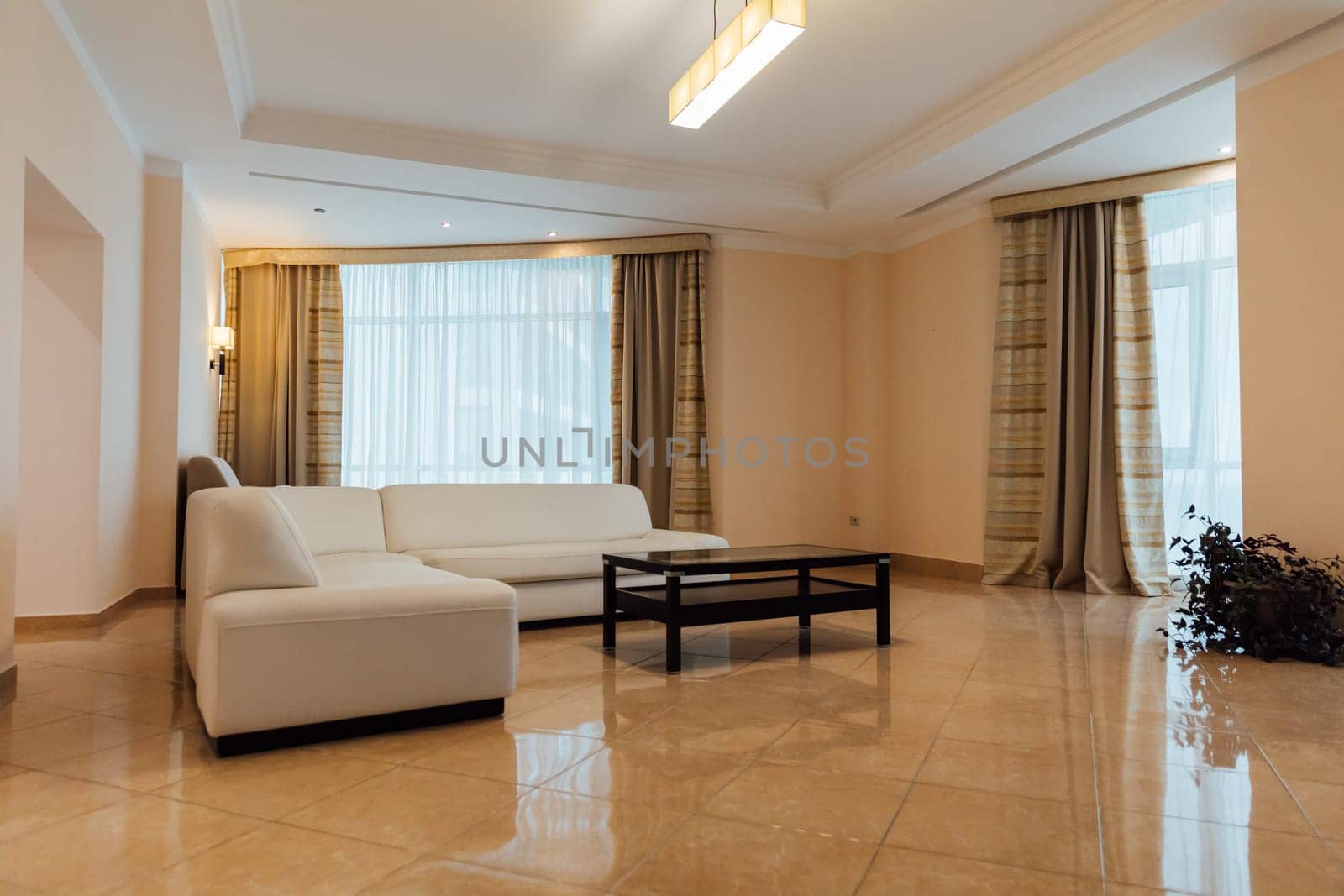 Interior of a room with a sofa and windows