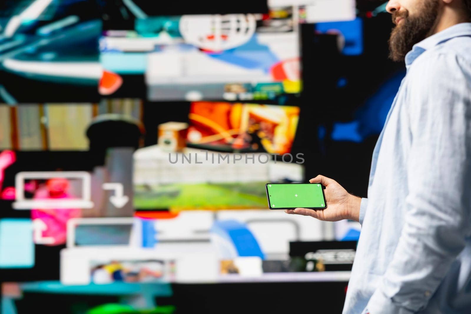 Young influencer checks phone with mockup screen for activity on social media platforms, leveraging innovation and mobile technology to maintain engagement and build a community. Social network.