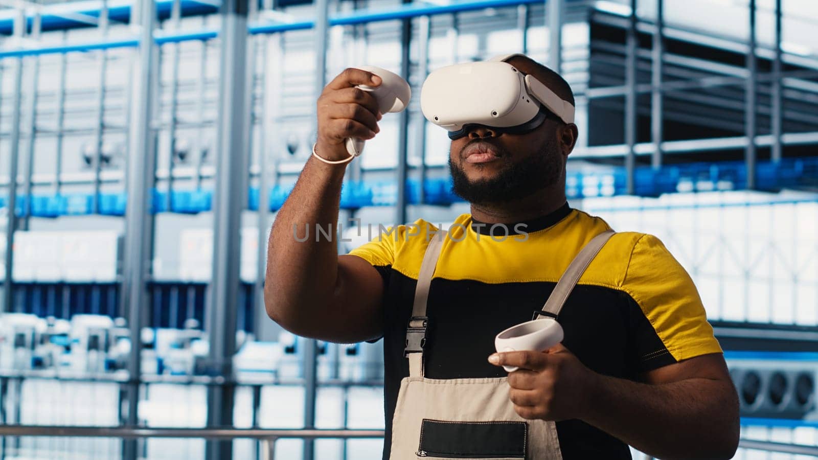 Smart factory engineer using VR headset to oversee operation of robotic arms and conveyor belts. Industry 4.0 plant technician monitors system performance using virtual reality, camera A
