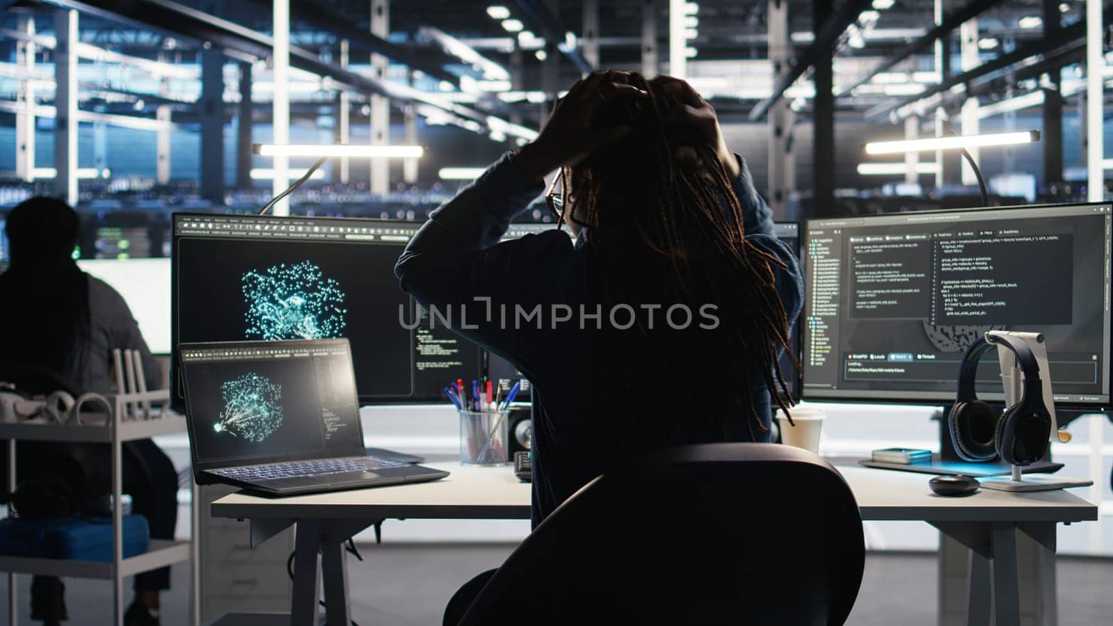 Angry server hub developer frustrated by slow data analytics AI generator. Annoyed data center worker punching desk, irked by glitching artificial intelligence program showing system metrics, camera A